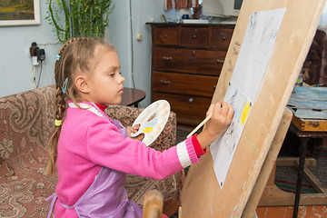 Image showing A girl studying painting in the artist\'s studio