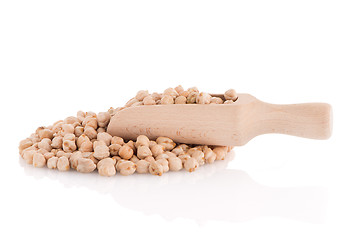 Image showing Uncooked chickpeas and wooden scoop