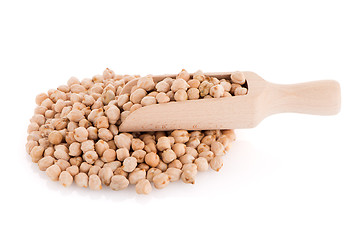 Image showing Uncooked chickpeas and wooden scoop