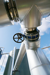 Image showing Industrial zone, Steel pipelines and valves against blue sky