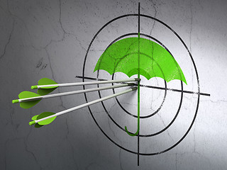 Image showing Security concept: arrows in Umbrella target on wall background