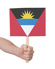 Image showing Hand holding small card - Flag of Antigua and Barbuda