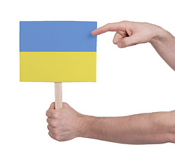 Image showing Hand holding small card - Flag of Ukraine