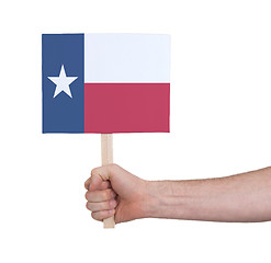 Image showing Hand holding small card - Flag of Texas