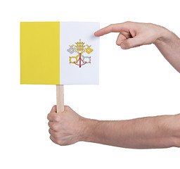 Image showing Hand holding small card - Flag of Vatican City