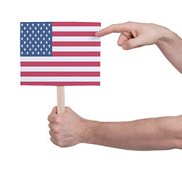 Image showing Hand holding small card - Flag of the USA