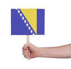 Image showing Hand holding small card - Flag of Bosnia Herzegovina