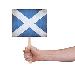 Image showing Hand holding small card - Flag of Scotland