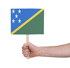 Image showing Hand holding small card - Flag of Solomon Islands