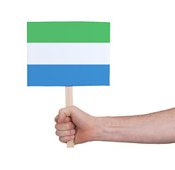 Image showing Hand holding small card - Flag of Sierra Leone