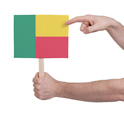 Image showing Hand holding small card - Flag of Benin