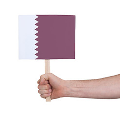 Image showing Hand holding small card - Flag of Qatar