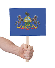 Image showing Hand holding small card - Flag of Pennsylvania