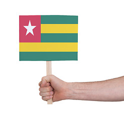 Image showing Hand holding small card - Flag of Togo