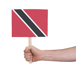 Image showing Hand holding small card - Flag of Trinidad and Tobago