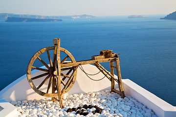 Image showing greece in santorini  sea and spinning wheel