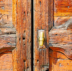 Image showing europe old in  italy  antique close brown door and rusty lock  c