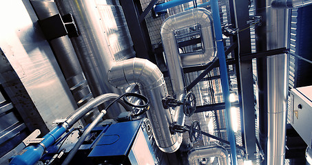 Image showing Equipment, cables and piping as found inside of a modern industr