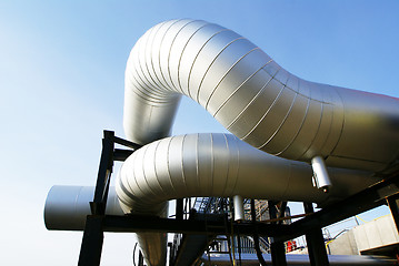 Image showing Industrial zone, Steel pipelines and valves against blue sky