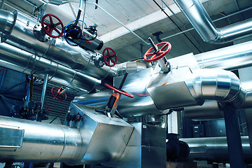 Image showing Equipment, cables and piping as found inside of a modern industr