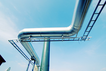 Image showing Industrial zone, Steel pipe-lines on blue sky