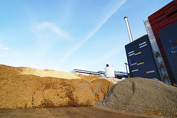 Image showing bio power plant with storage of wooden fuel (biomass) against bl