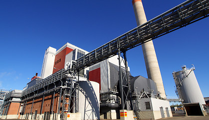 Image showing Modern industrial factory against blue sky