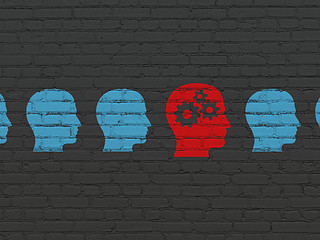 Image showing Business concept: head with gears icon on wall background