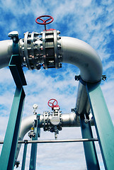 Image showing Industrial zone, Steel pipelines and valves against blue sky