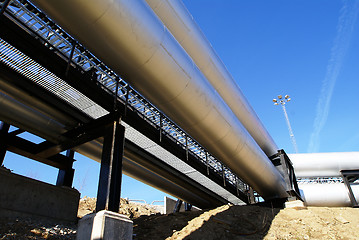 Image showing Industrial zone, Steel pipelines and valves against blue sky