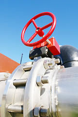 Image showing Industrial zone, Steel pipelines and valves against blue sky