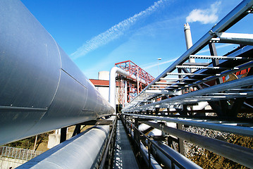 Image showing Industrial zone, Steel pipelines and valves against blue sky