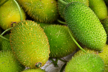 Image showing Heap of ripe gac fruit in market
