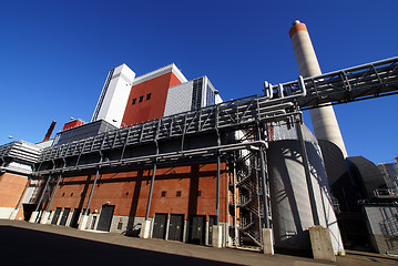 Image showing Modern industrial factory against blue sky