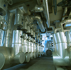 Image showing Equipment, cables and piping as found inside of a modern industr