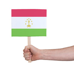 Image showing Hand holding small card - Flag of Tajikistan