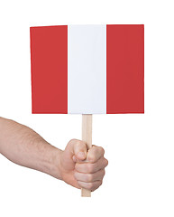 Image showing Hand holding small card - Flag of Peru