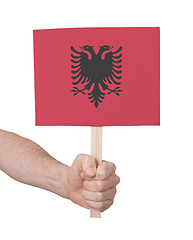 Image showing Hand holding small card - Flag of Albania