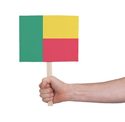 Image showing Hand holding small card - Flag of Benin