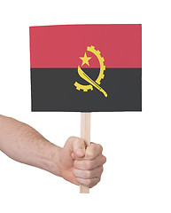 Image showing Hand holding small card - Flag of Angola