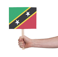 Image showing Hand holding small card - Flag of Saint Kitts and Nevis