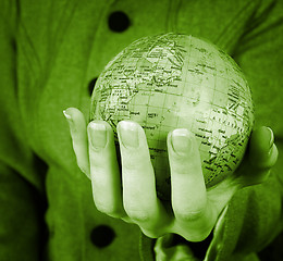 Image showing Globe in a girl's hands