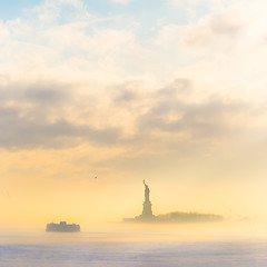 Image showing Staten Island Ferry cruises past the Statue of Liberty.