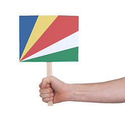 Image showing Hand holding small card - Flag of Seychelles