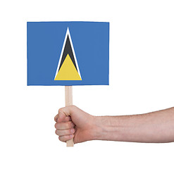 Image showing Hand holding small card - Flag of Saint Lucia