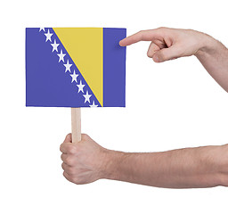 Image showing Hand holding small card - Flag of Bosnia Herzegovina