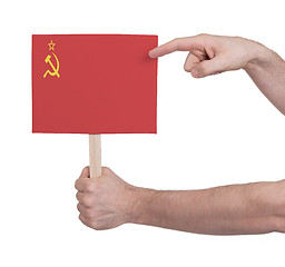 Image showing Hand holding small card - Flag of the USSR