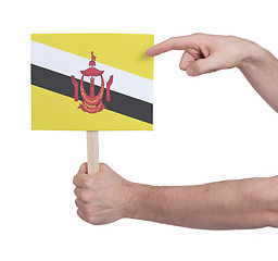 Image showing Hand holding small card - Flag of Brunei