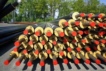 Image showing PVC pipes stacked in construction site    