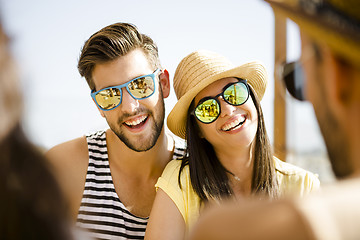 Image showing Friends at the beach bar